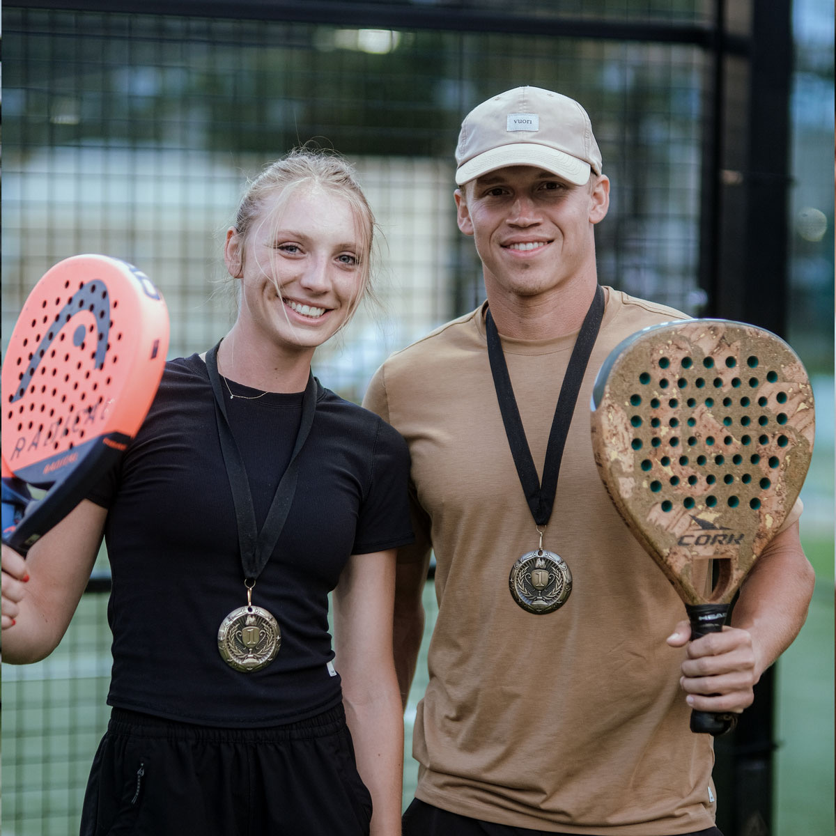 Padel players celebrating together at Padel39