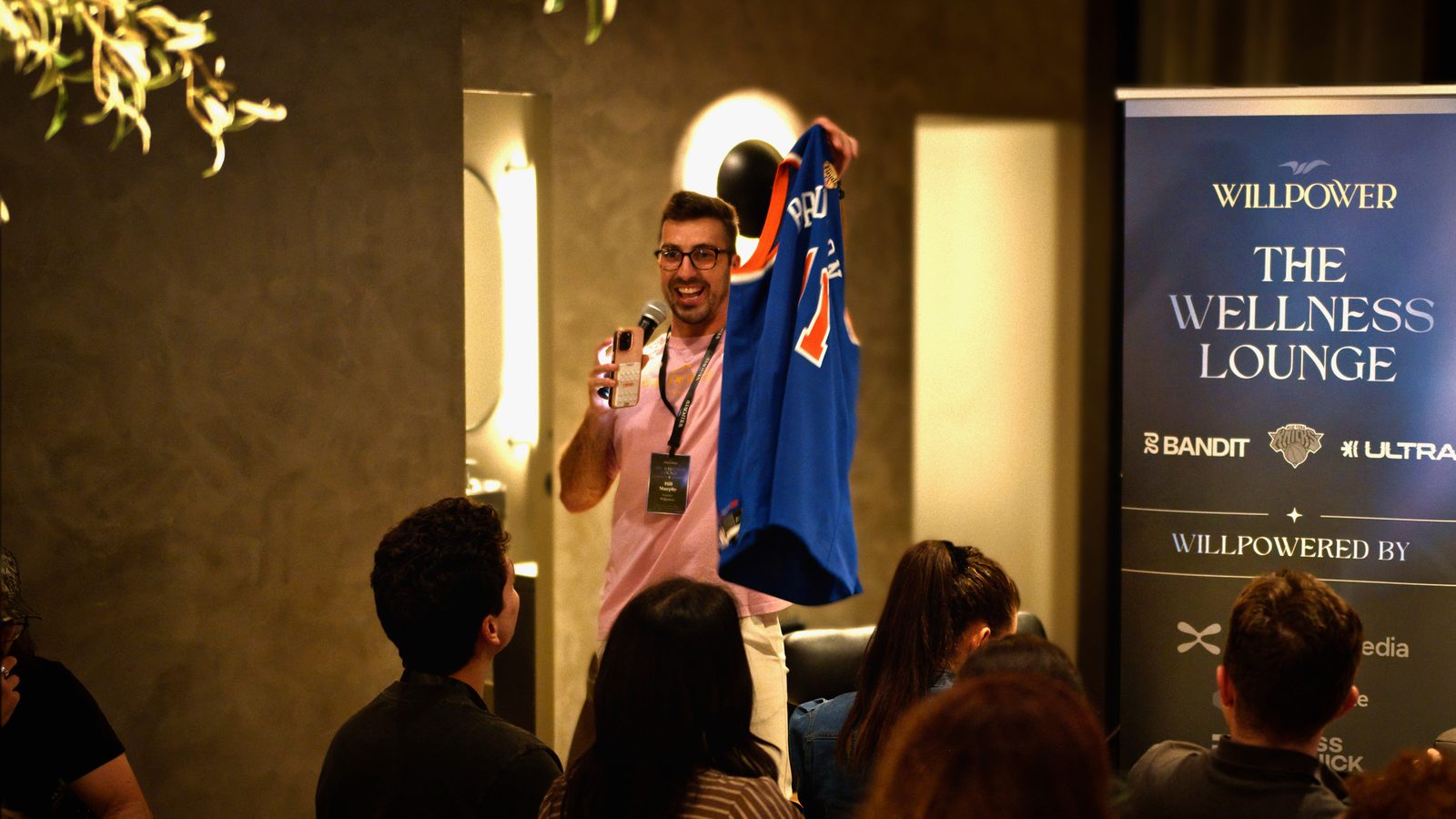 A Knicks jersey held up to the room during the panel